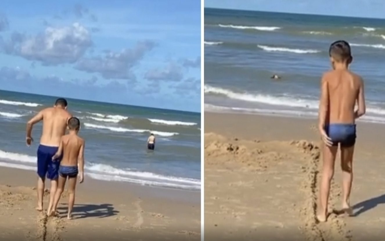 c/VÍDEO: Pai marca caminho no areal para filho cego o seguir até ao mar